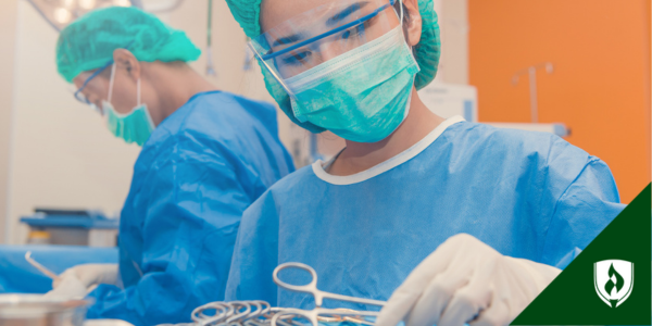 A surgical technologist organizes surgical tools before the surgery