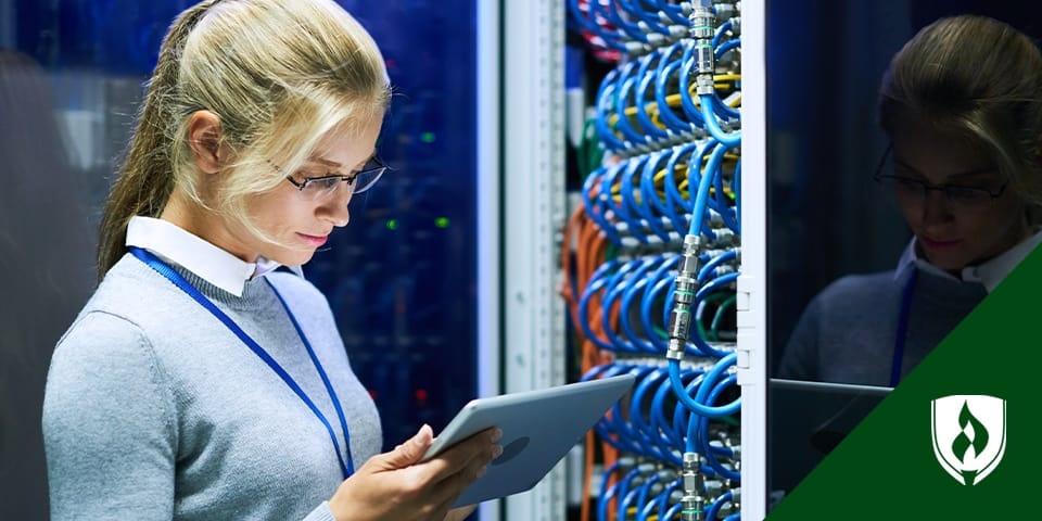 woman working on tablet in server room