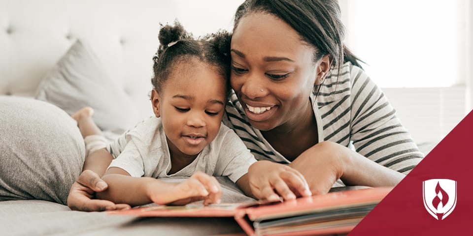 mother reading a book with young daughter compressed