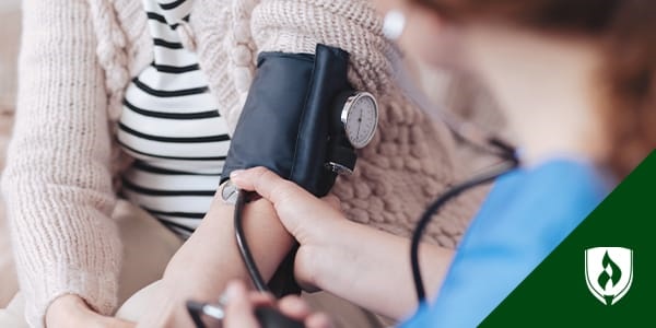 photo of a public health nurse taking a patient's blood pressure