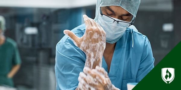 photo of a scrub tech scurbbing into surgery representing surgical tech duties