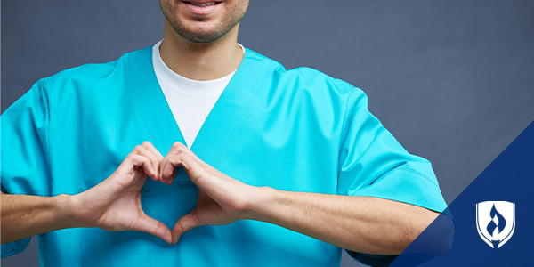 male nursing making a heart with his hands