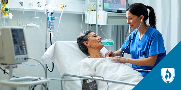 photo of a nurse auscultating on a patient in a hospital bed