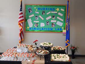 Nursing simulation lab celebration with cake and cupcakes