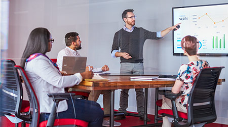 man presenting charts-graphs in meeting 