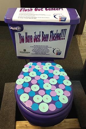 Painted purple toilet to raise money for flush away cancer