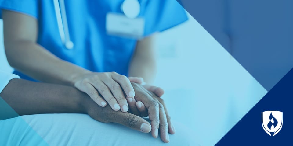 nurse holding patients hand with blue overlay