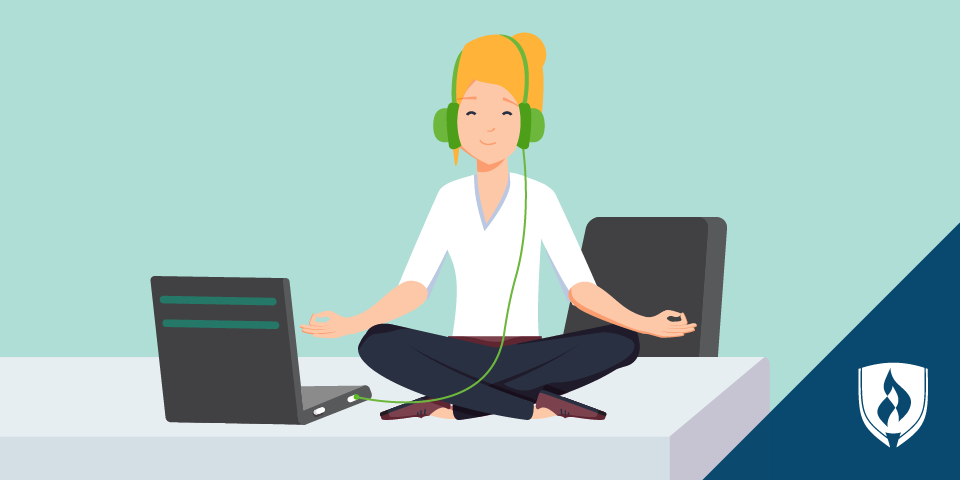 girl with headphones meditating by computer