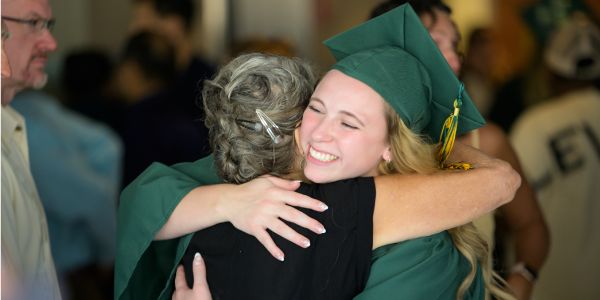 Rasmussen graduate hugging a parent