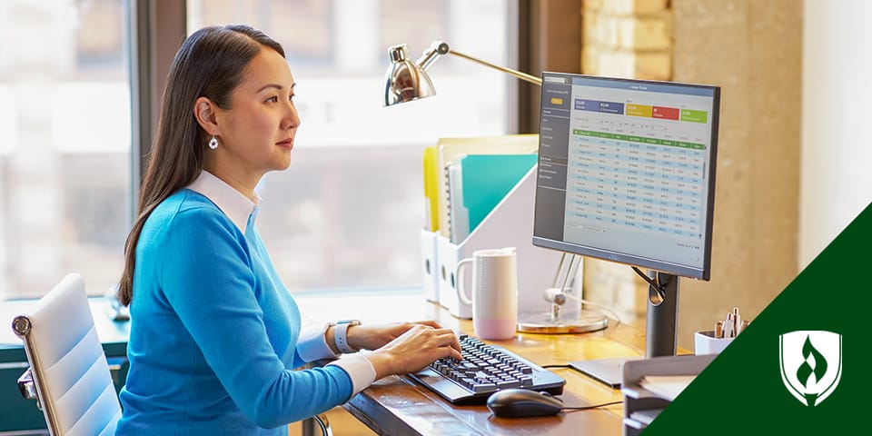 woman working with spreadsheets on computer
