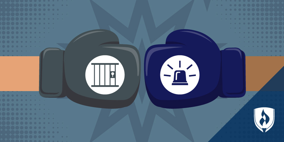 boxing gloves with icons depicting a jail cell and a siren
