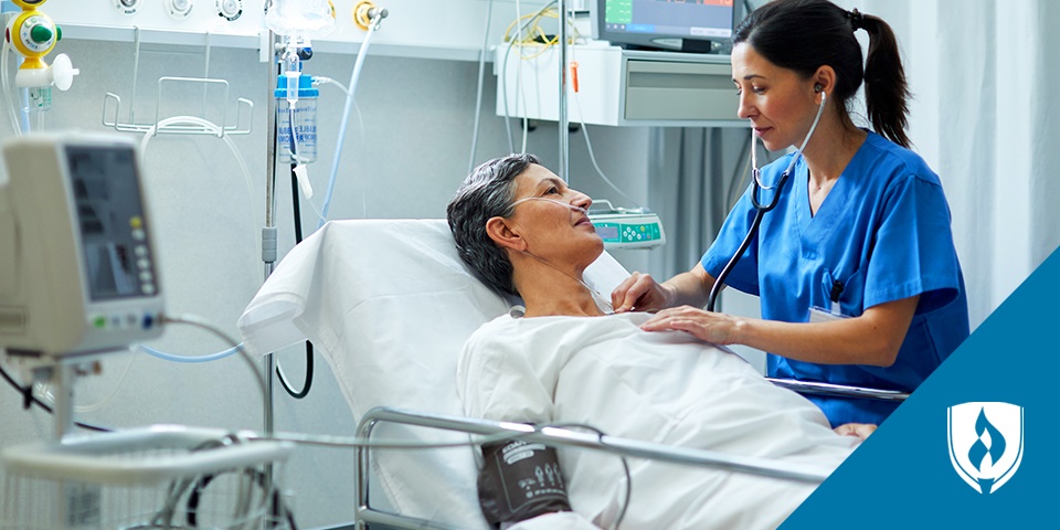 photo of a nurse auscultating on a patient in a hospital bed