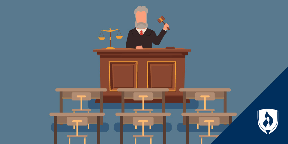 judge sitting in front of empty desks