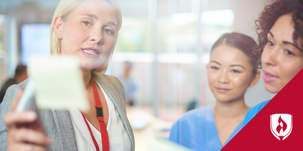 female healthcare manager talking to female nurses