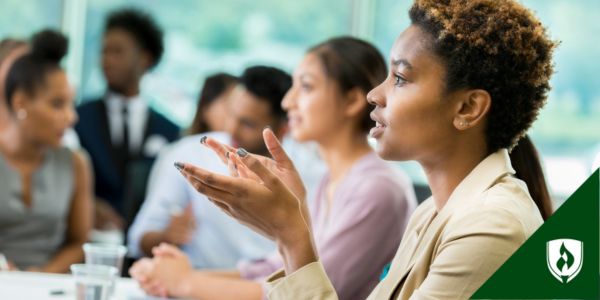 A corporate lawyer meets with a team of business leaders