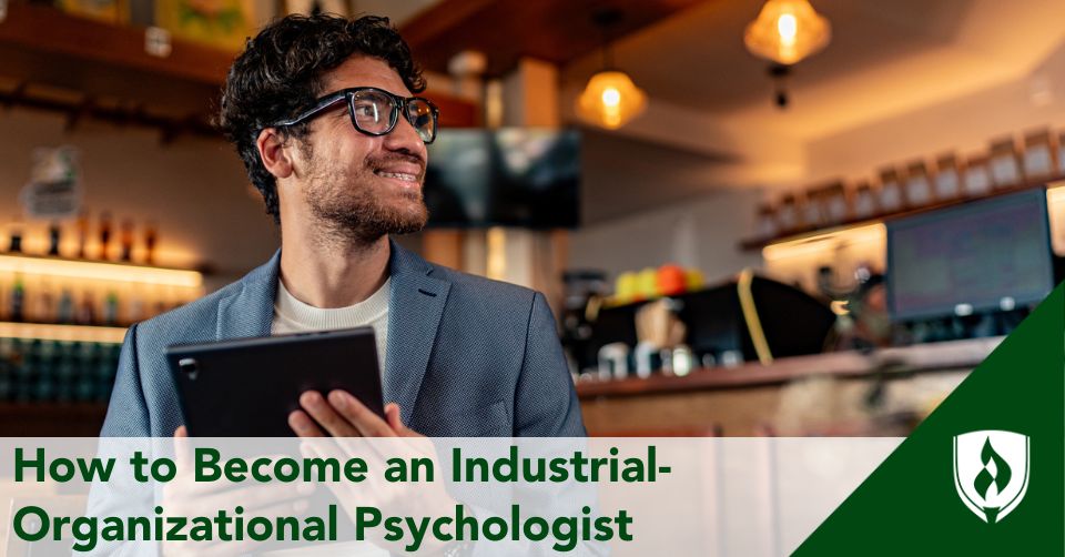 A business professional holds a tablet