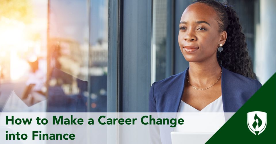 A business professional stands next to a bright window
