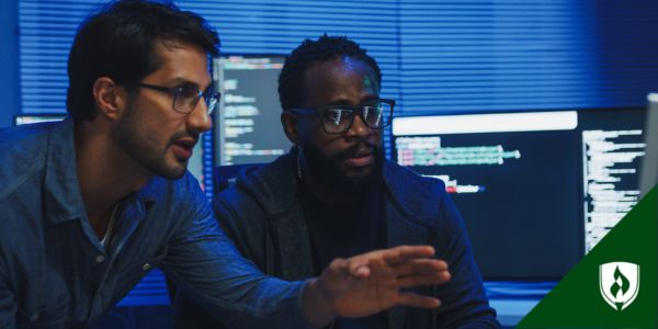 Two business professionals explore the capability of an AI tool in the office