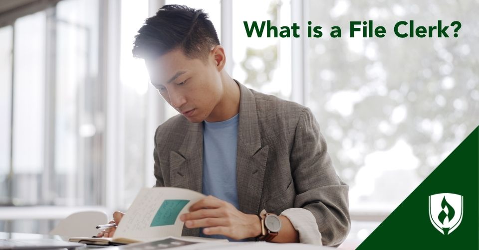 file clerk header A file clerk looks through hardcopy documents