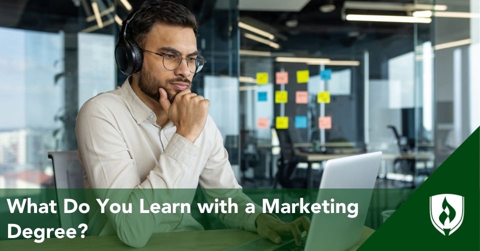 marketing degree header A marketing major works on his computer in a marketing office