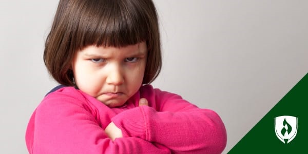photo of a preschooling making an angry face representing working with defiant preschoolers