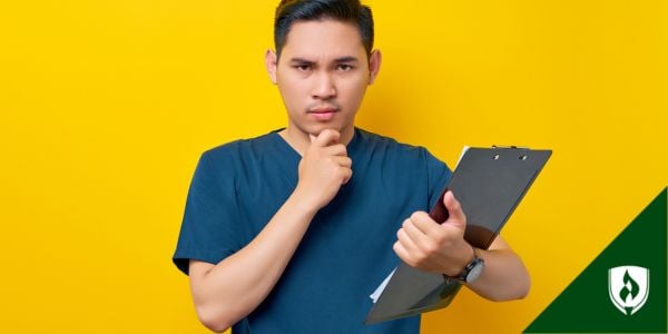 A healthcare professional looks curious