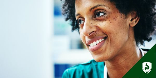 A professional smiles and looks to the side