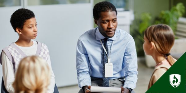 A foster care case manager meets with a few children