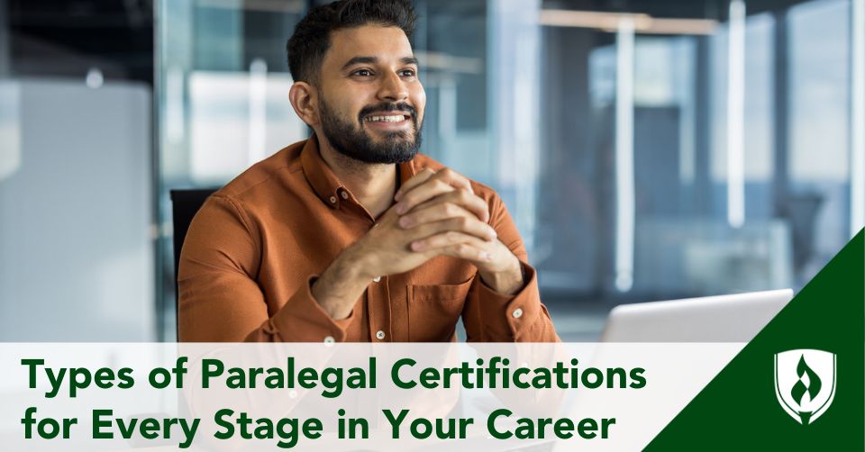 A paralegal sits at his desk smiling and pursuing certification