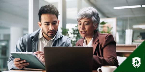 A legal secretary and a paralegal discuss the workflow