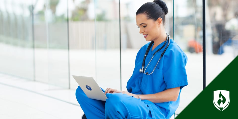 female nurse working on laptop