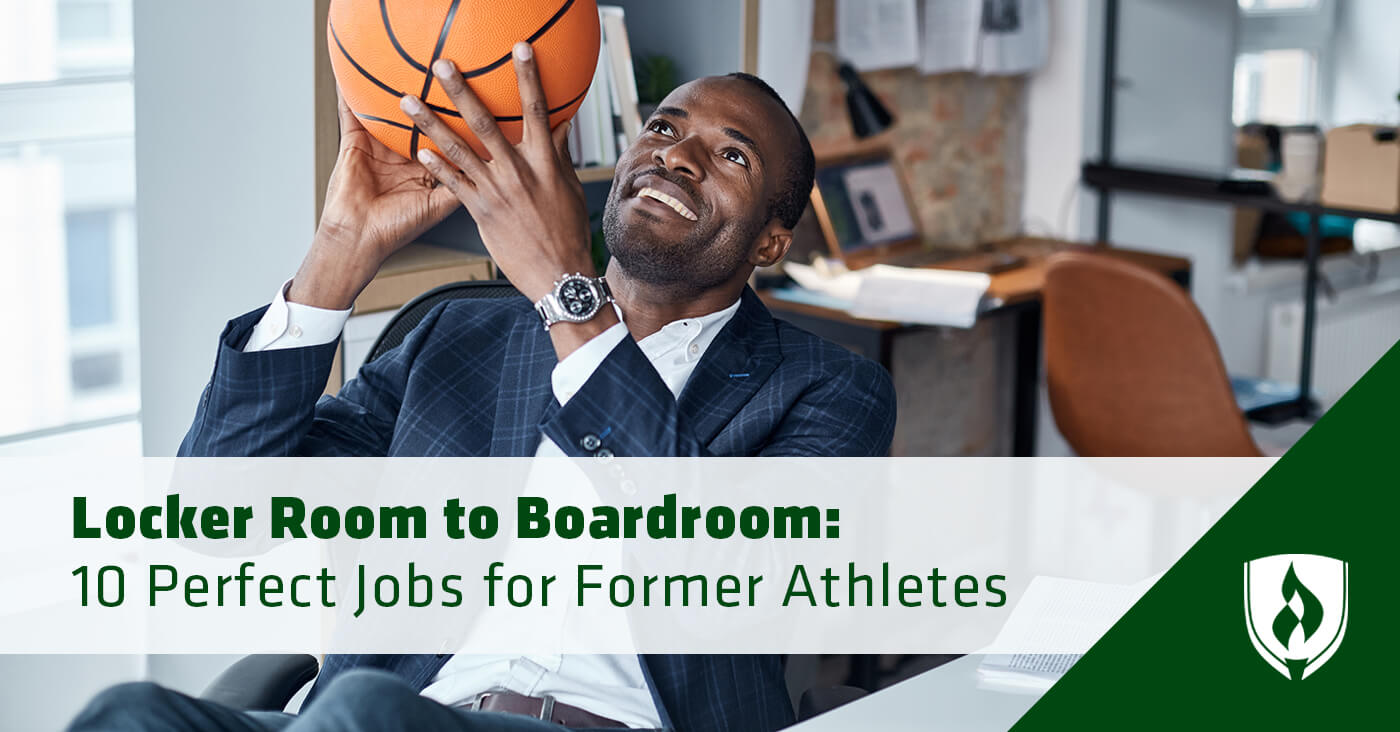 business man sitting at office desk with basketball in hands