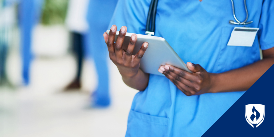 close up of nurse holding a tablet