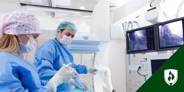 photo of an interventional radiologist and a IR technolgoist performing a prcedure