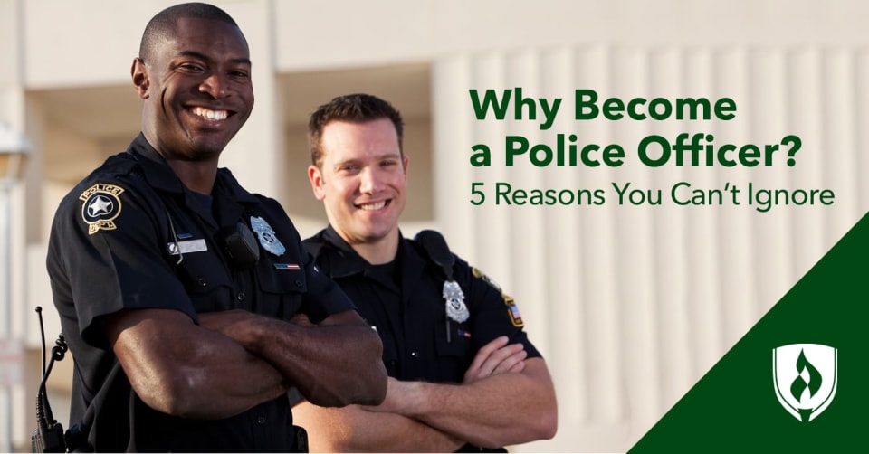 Two smiling police officers with their arms crossed.
