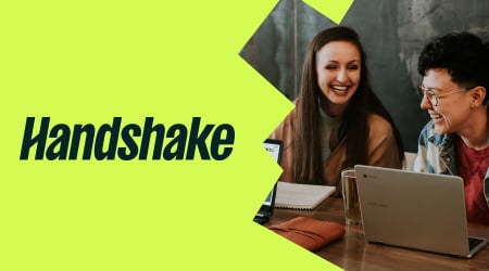Handshake logo with two laughing students in front of laptops